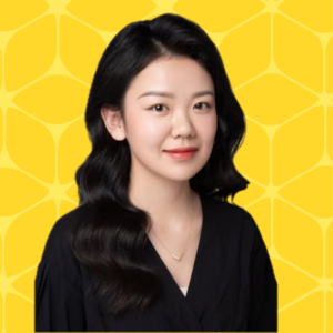 headshot of Sherry Wang who is smiling with a yellow box designed background