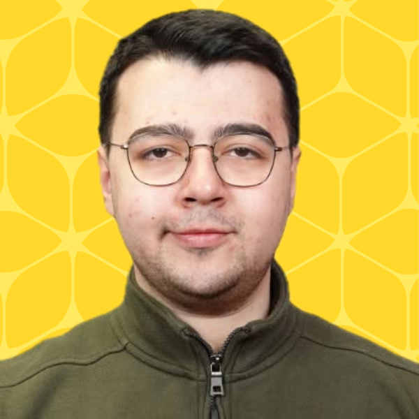 Ismail Can Yagmur headshot smiling with a yellow box background