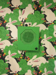 Detail of pre-existing wallpaper and speaker