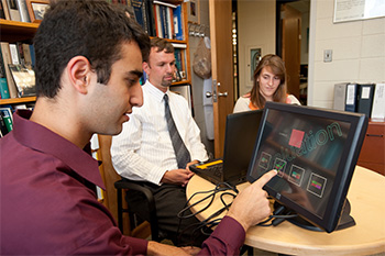 Public health students working on a project with Professor VanWijngaarden.