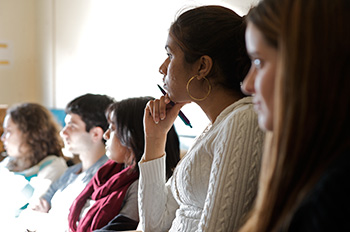 Students taking notes in class.