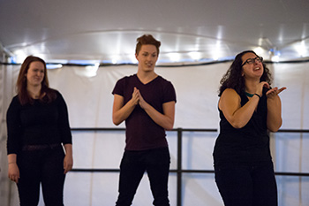 Members of the ASL Club sign to pop songs at Rochester Dinner Revue