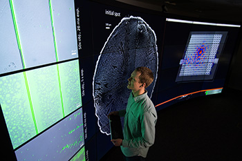 Student examines data sets from his research at the VISTA Collaboratory