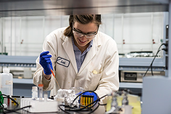 Chemistry student working in a lab.