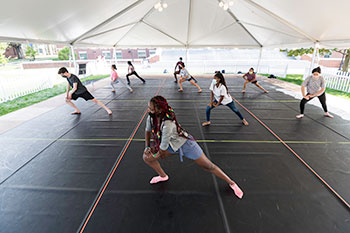 Students stretching before a dance class.