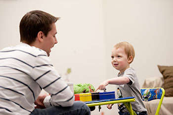 Student working with a child