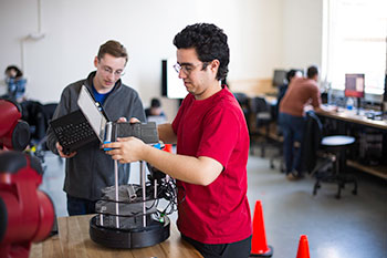 Electrical engineering students working on a project