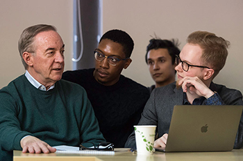 Students meeting with a professor