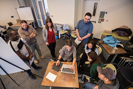 Faculty and staff in class.
