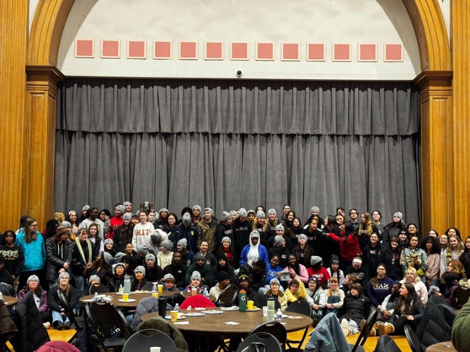 A large group in an auditorium.