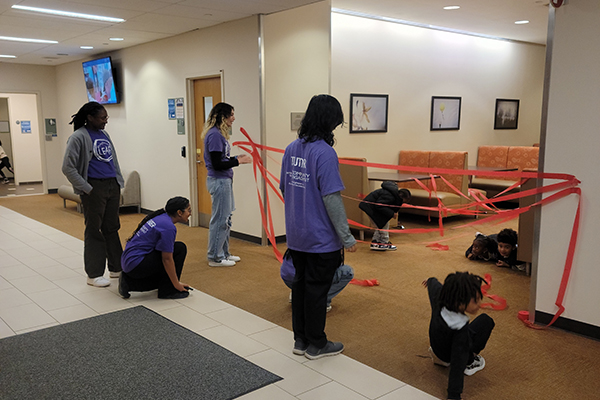 A group of students leading LEAP participants in an activity.