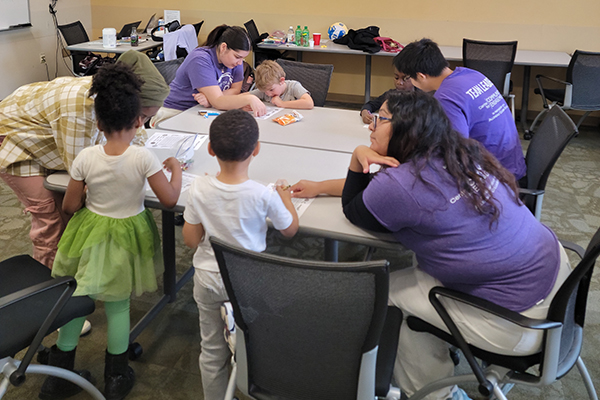 LEAP participants doing an activity at a table.