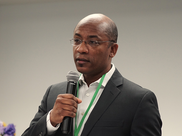 A person speaking into a microphone.