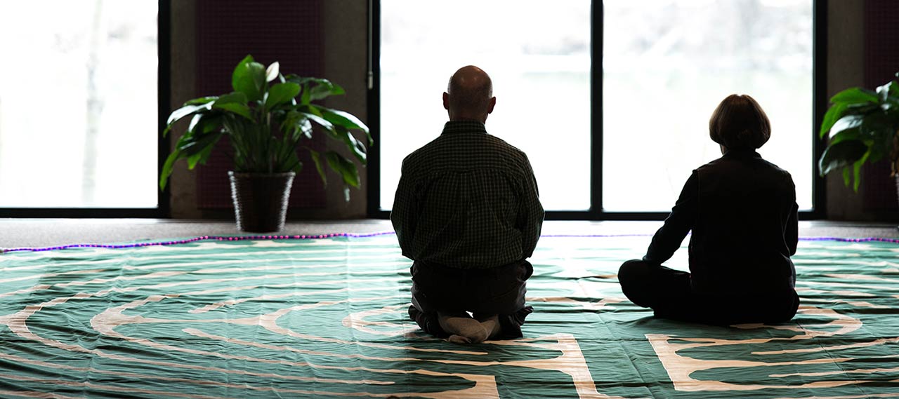 Two people meditating