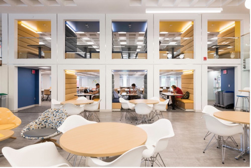 A view of people studying in a room.