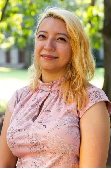 Adriana standing in front of Lattimore Hall.