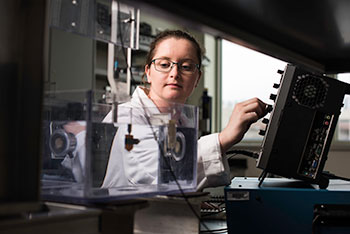 Graduate student working in a lab.