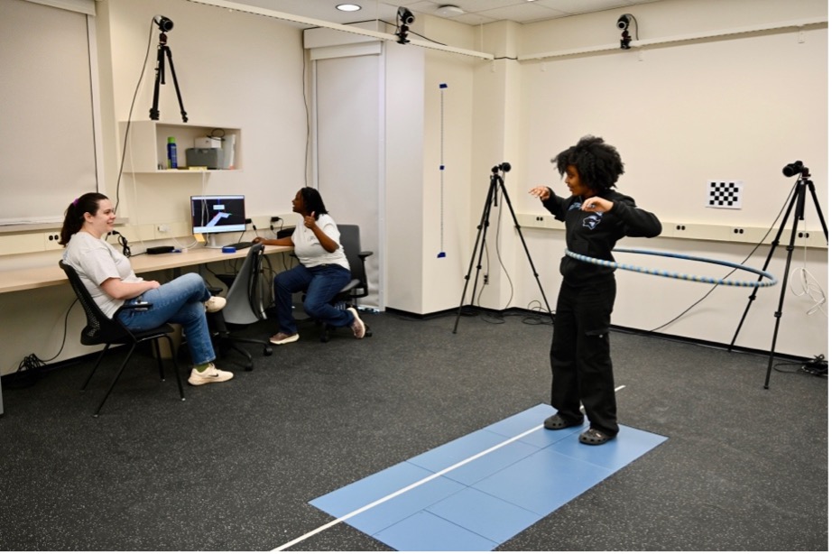 A student using a hula hoop.