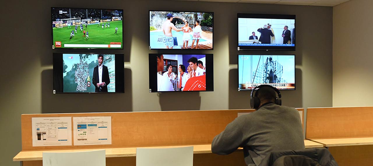 A student listening watching foreign television