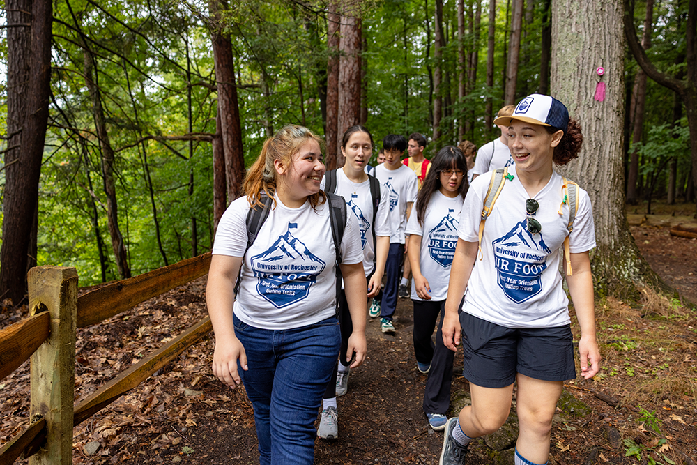 Students chat as they hike in Letchworth State Park during the 2025 FOOT program