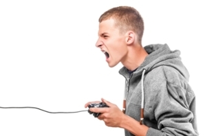Male teenager playing a video game