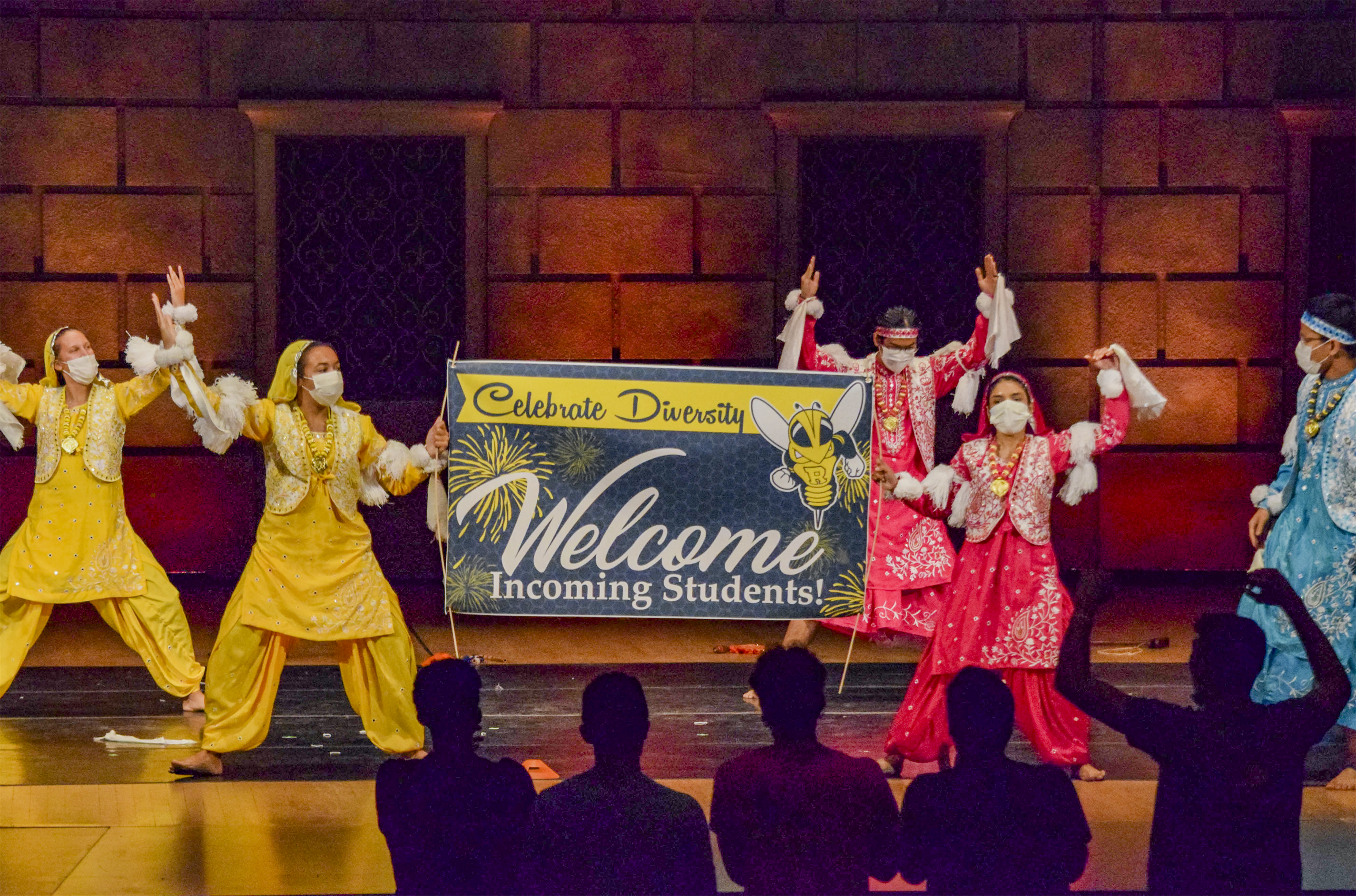 Students on stage with Celebrate Diversity Banner