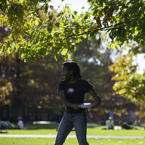 Student preparing to throw a flying disc