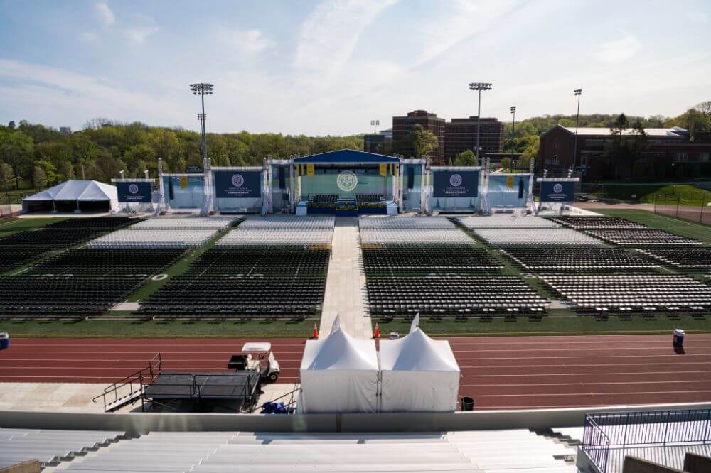 Class of 2022 students celebrating graduation on Rochester's campus.