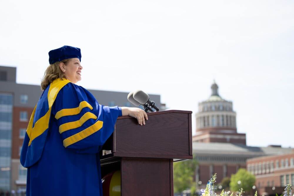 Class of 2022 students celebrating graduation on Rochester's campus.