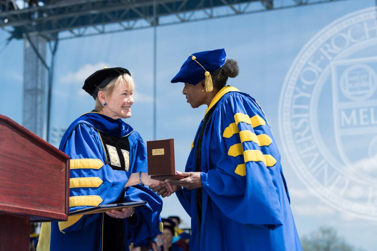 Class of 2022 students celebrating graduation on Rochester's campus.