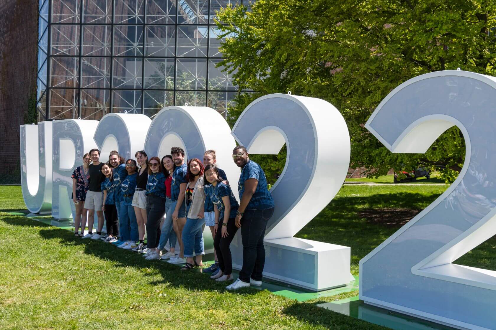 Class of 2022 students celebrating graduation on Rochester's campus.