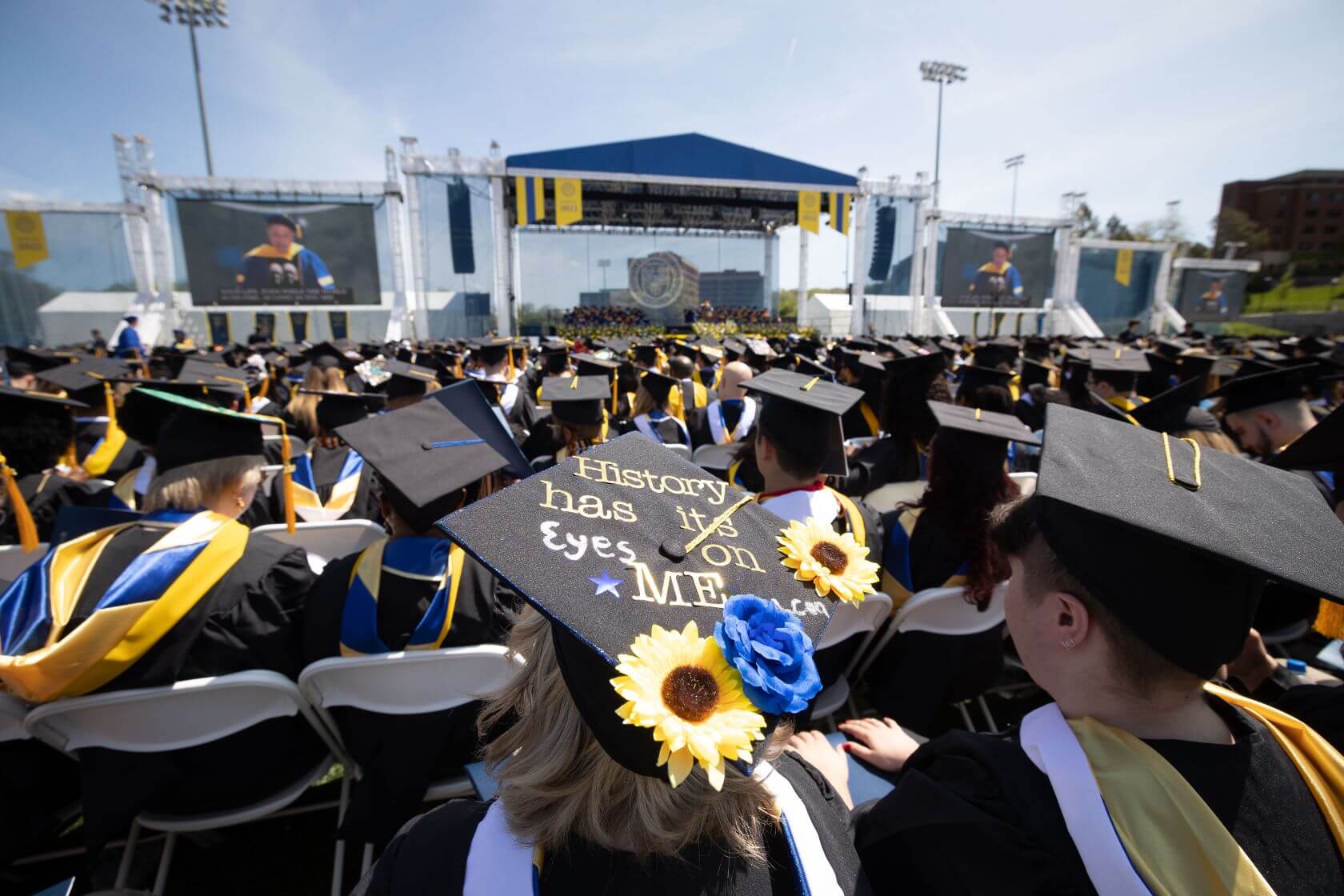 Class of 2022 students celebrating graduation on Rochester's campus.