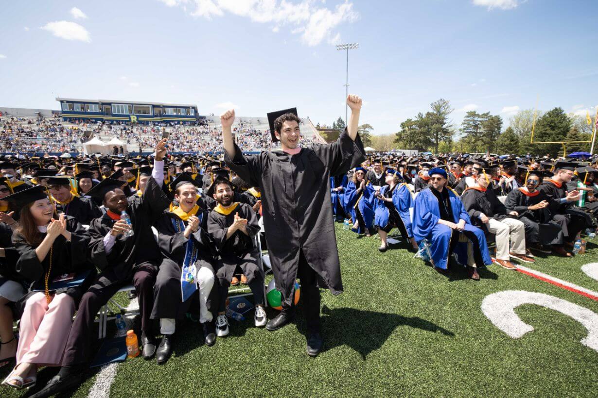 Class of 2022 students celebrating graduation on Rochester's campus.