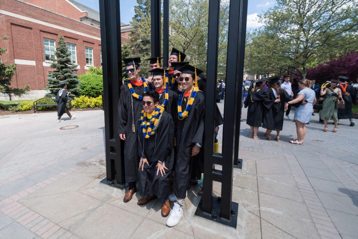 Class of 2022 students celebrating graduation on Rochester's campus.