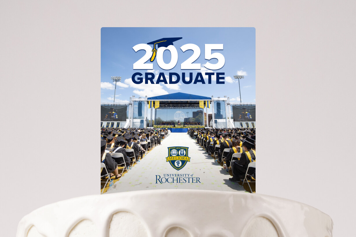 A graduation card featuring a photo of a jubilant crowd celebrating a graduation ceremony.