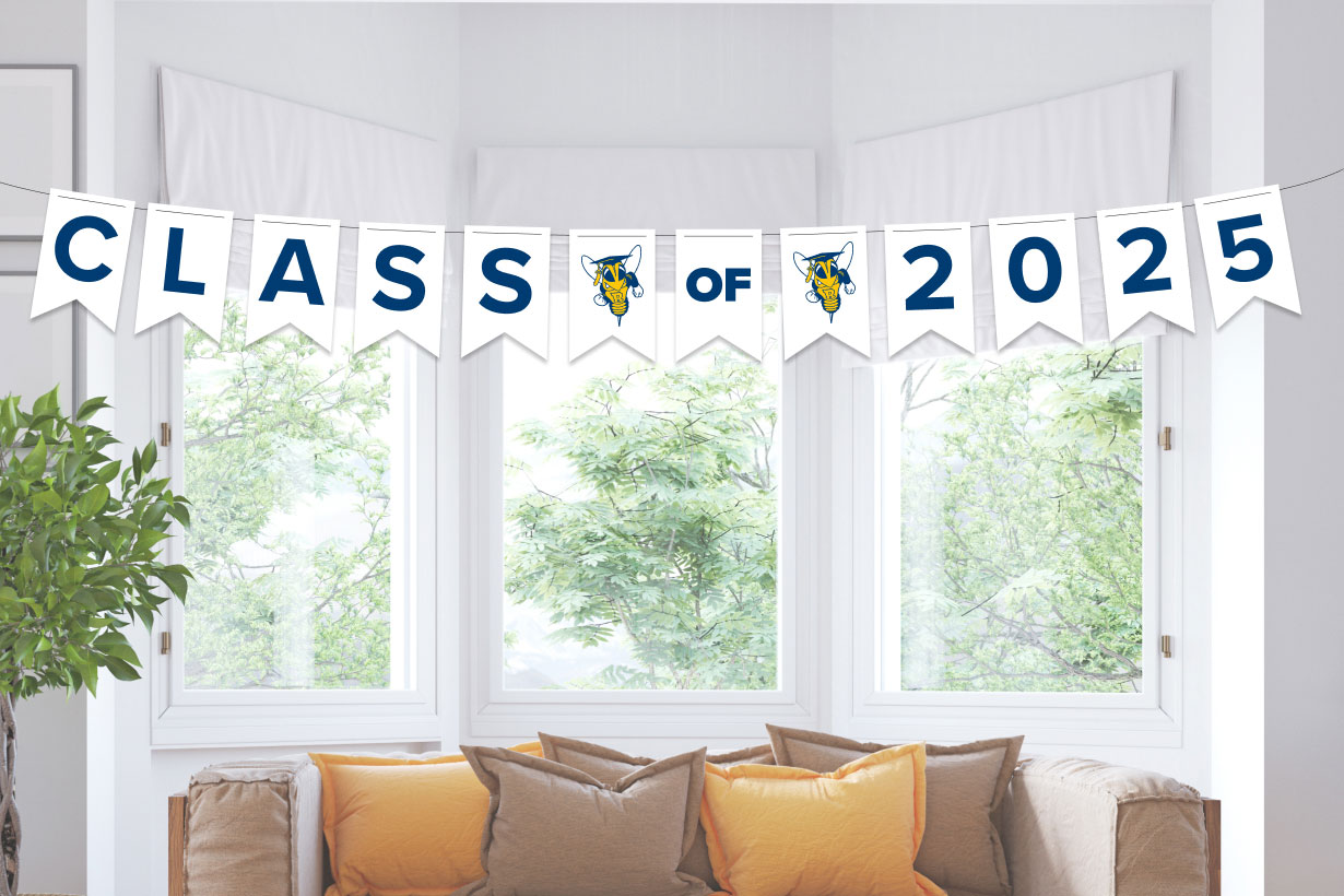 A white banner displaying 'Class of 2025' in bold letters, representing the University of Rochester's graduating class
