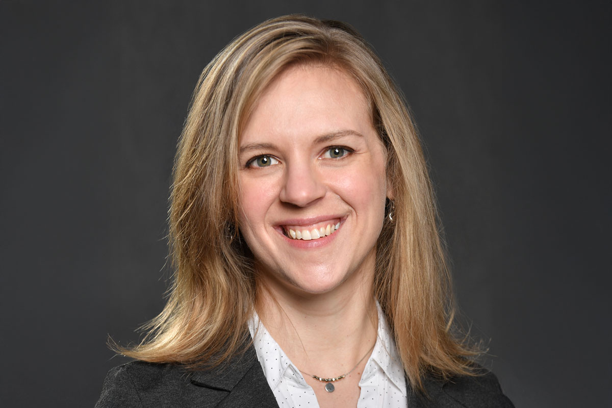 A smiling woman in a business suit, Marielle Jensen-Battaglia, a University of Rochester Class of 2025 student.