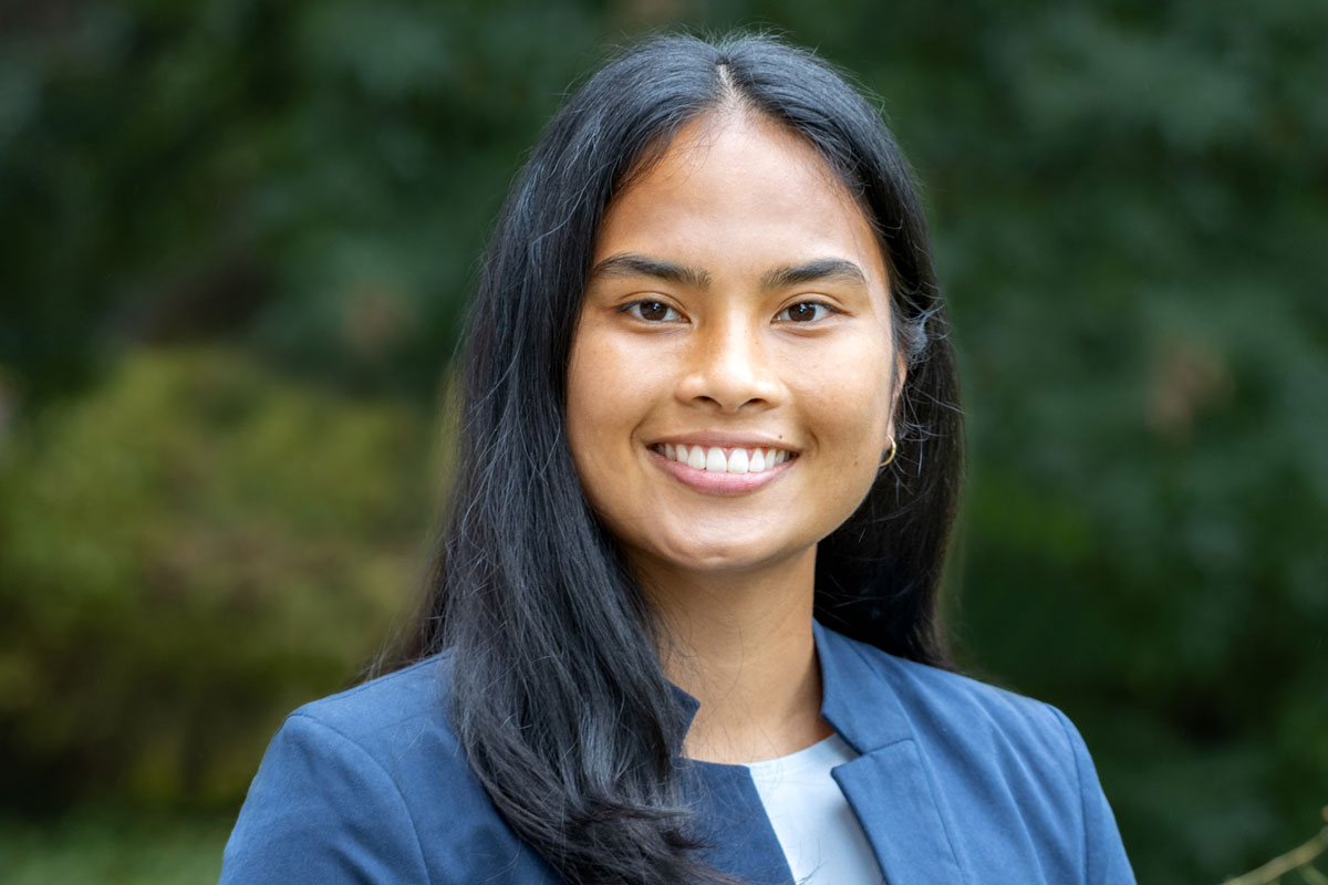 A woman with long black hair wearing a blue blazer, Mara Heppard, a University of Rochester Class of 2025 student.