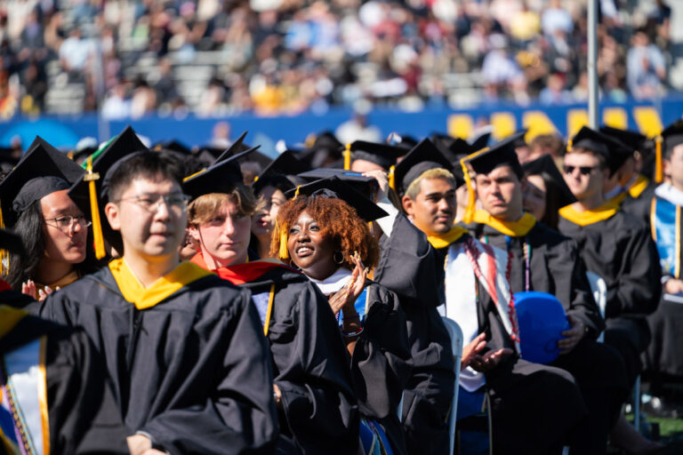 University of Rochester graduates applaud during the Commencement Weekend ceremony.