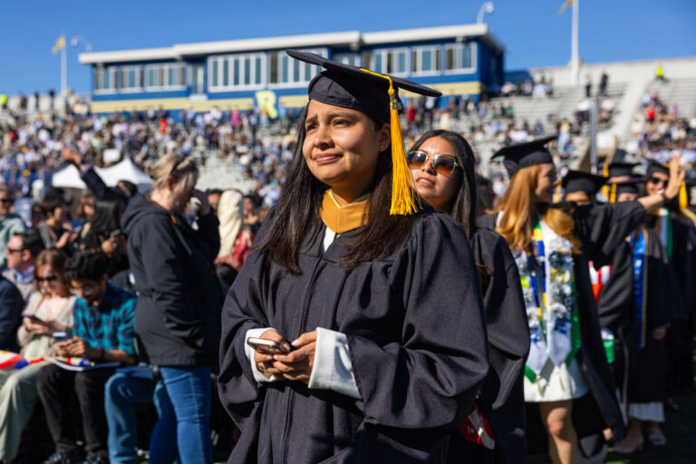University of Rochester graduates stand in line at Fauver Stadium during Commencement Weekend.