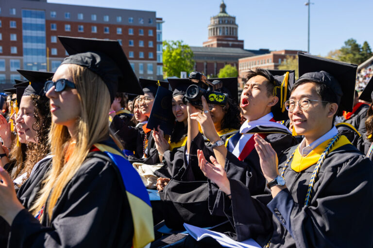 University of Rochester graduates applaud and cheer during the Commencement Weekend ceremony.