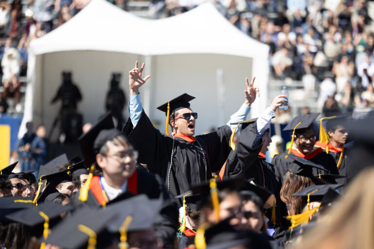 University of Rochester graduates applaud during the Commencement Weekend ceremony.