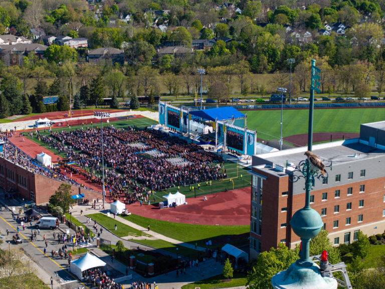 Aerial view of the University of Rochester Commencement Weekend ceremony at Fauver Stadium.