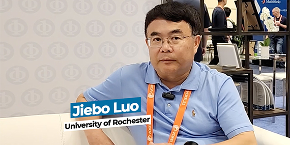 A graphic reading "Jiebo Luo University of Rochester" is overlaid on a photo of him sitting on a couch