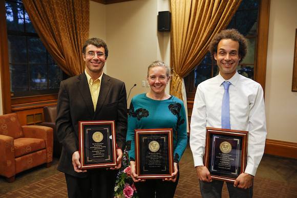 Christopher Niemiec, Kristin Doughty, and Mark Buckley holding award plaques 