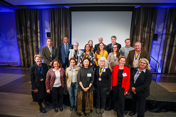 A group shot of recipients of new distinguished professorships pose in Feldman Ballroom during the Distinguished Faculty Celebration.