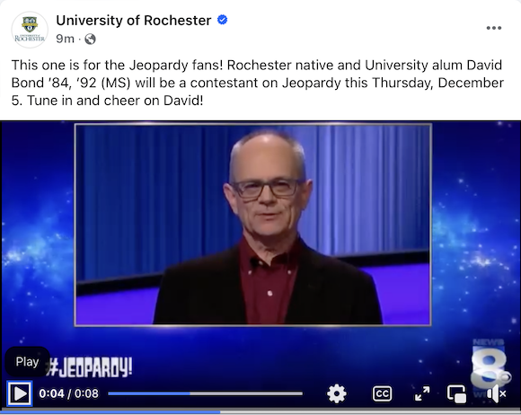 Screenshot of the University of Rochester Facebook page, showing alumnus David Bond behind a Jeopardy podium
