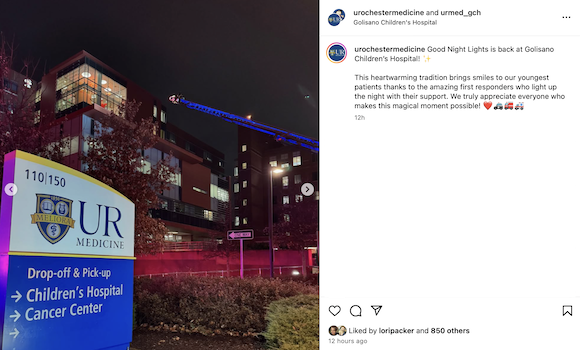 External sign for Golisano Children's Hospital, with holiday lights from first responders