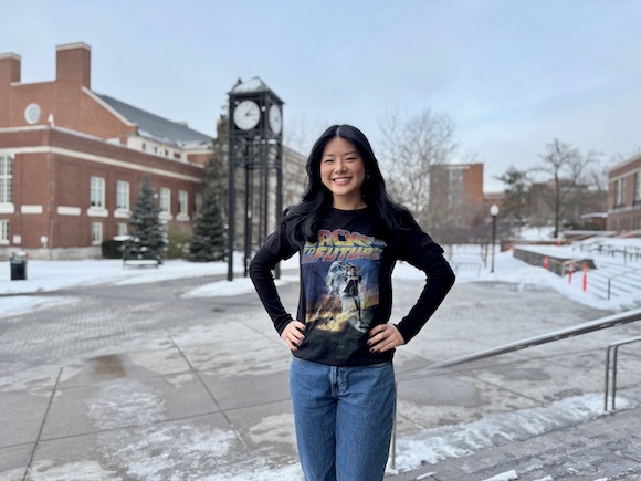 Becky Frank in a Back to the Future T-shirt in front of the University of Rochester clock tower