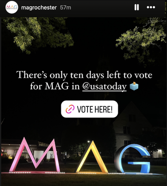Screenshot of the Memorial Art Gallery Instagram story. Large MAG letters lit up outside. 